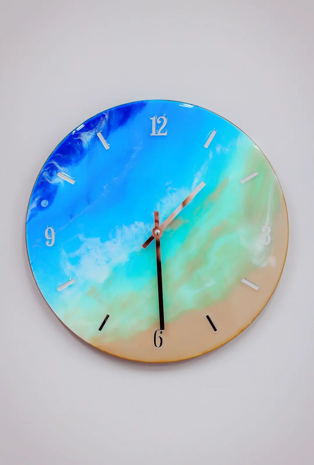 Bright blue resin clock that fades to sand color