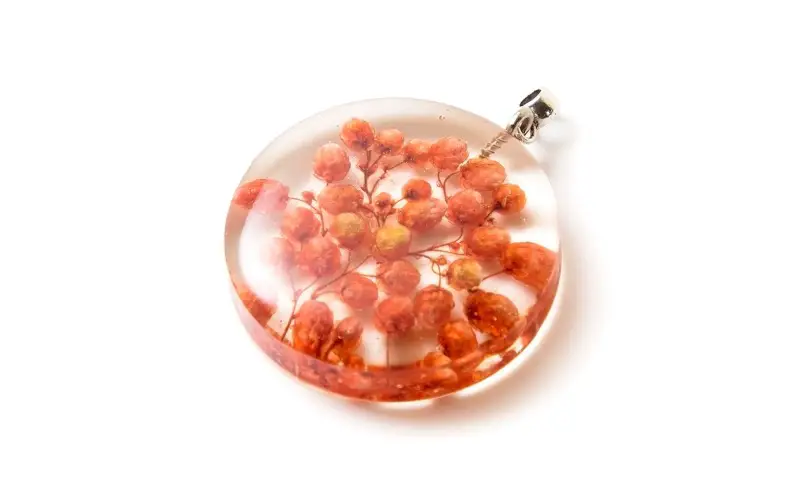 Resin pendant with orange Flower